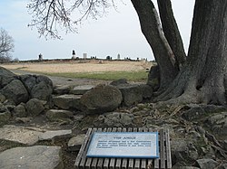 Plaque inscribed "General Armistead and a few Confederate soldiers charged across this wall, reached the Union cannon behind it and were soon overwhelmed"[1]