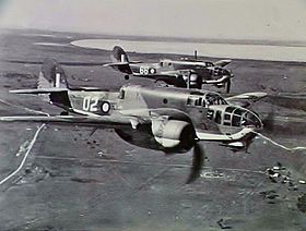 Two twin-engined military aircraft in flight