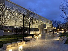 The memorial lit up at night.