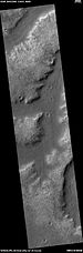 Wide view of a group of channels, as seen by HiRISE under HiWish project Some parts of the surface show patterned ground when enlarged.