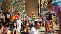 Pride parade with ferris wheel in background, 2022