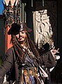 Image 34A person costumed in the character of captain Jack Sparrow, Johnny Depp's lead role in the Pirates of the Caribbean film series (from Piracy)