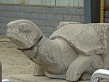 A stele-bearing turtle; tomb of Xiao Xiu