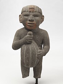 Sculpture of a man carrying a cacao pod. Aztec, 1440-1521 AD