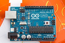 Arduino UNO R2 board with ATmega328P 8-bit microcontroller in DIP28N IC socket