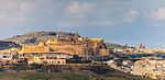 Skyline of a small fortified city.