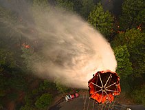 U.S. Airmen with the 129th Rescue Wing, California Air National Guard drop water on the Rim Fire near Yosemite, California, August 26, 2013