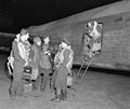 Early morning, crew disembarks after returning from a raid