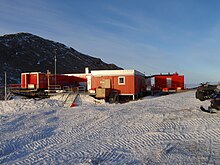 Photo of an outpost surrounded by snow.