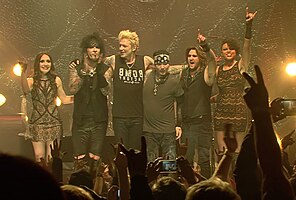 Sixx:A.M. in 2015. From left to right: Amber Vanbuskirk, Nikki Sixx, James Michael, DJ Ashba, Dustin Steinke and Melissa Harding