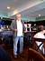 Nolan Bushnell speaking in a coffee shop