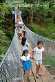 Children crossing a footbrige in El Salvador