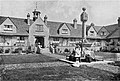 The quadrangle at Sidney Hill Cottage Homes looking towards the central archway and sundial