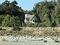 The Waiho River flows through the town of Franz Josef, passing features such as the St James Church