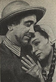 Emil Bolek v roli Petra Jevenbergera a Marie Halová v roli v roli Antje v komedii P. Schurka „Modrý tulipán“ (1942)