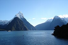 Blue water against a backdrop of snow-capped mountains