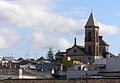 Torre della Basilica del Carmen sopra i tetti del centro storico.