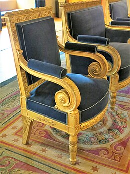 Neoclassical rosettes on the arms of an armchair, by Jacob Desmalter, 1808, gilded wood, Louvre