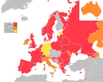 Map of countries in Europe, North Africa and Western Asia, with Australia as an insert in the top-right corner, coloured to indicate the decade in which they first participated in the contest: 2000s in red, 2010s in orange, 2020s in yellow