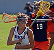 A Northwestern Wildcats women's lacrosse player in a game