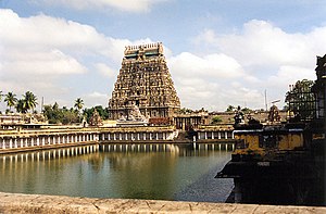 Large, ornate temple with a pool of water in front