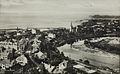 Tømmerfløtning i Nidelva ved Ila i Trondheim på 1920-tallet. Foto: Mittet & Co./Nasjonalbiblioteket