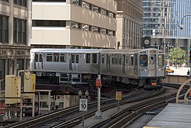 A Pink Line train approaches Randolph/Wabash.