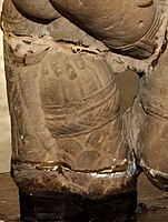 Vasudeva's mace held by one of his supplementary hands