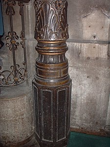 A sculpted cast iron post from the interior