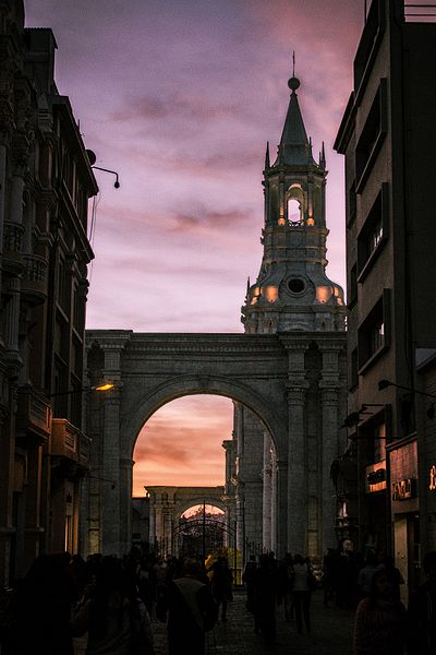 Peru: Arch and tower of the Basilica Cathedral of Arequipa (Spanish: Basílica Catedral). The cathedral is in the Plaza de Armas of the city of Arequipa, province of Arequipa. Construction first began in the year 1540. On several occasions, the building was damaged by earthquakes and subsequently restored.