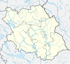 Mapa konturowa powiatu oleckiego, blisko centrum na prawo znajduje się punkt z opisem „Olecko”