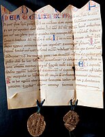 Carta partida en A.B.C. de la clerecia de Ledesma(any 1252), amb tall indentat i dos segells.