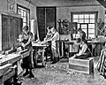 Image 7Students in a carpentry trade school learning woodworking skills, c. 1920 (from Vocational school)