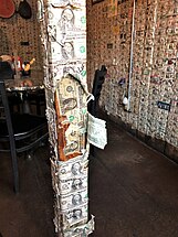 The walls of the Saloon are papered with dollar bills