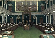 The Legislative Assembly seating in 1936. The crucifix, seen above the rostrum of the Speaker, was installed on October 7, 1936, and stayed there for almost 83 years. Its presence sparked debate about secularism in Quebec, until the National Assembly passed a motion to remove it.[9]