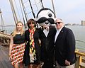 Former Governor Larry Hogan (right) and former Baltimore mayor Catherine Pugh (2nd from left) wearing state flag apparel