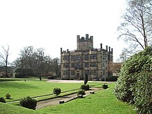 Large Jacobean three-storey house in landscaped grounds