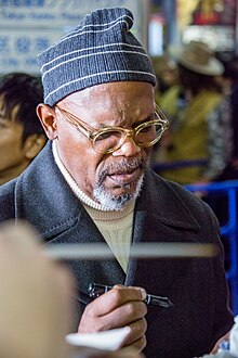 Jackson signing an autograph at the Japanese premiere of Kong: Skull Island in 2017