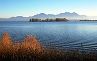 Krautinsel with (right) a small part of the Herreninsel island and in the background the Chiemgau Alps