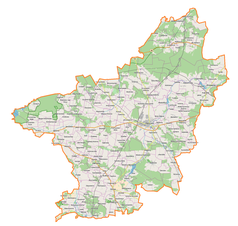 Mapa konturowa powiatu opoczyńskiego, blisko centrum na dole znajduje się punkt z opisem „Miedzna Drewniana”