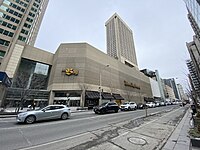 Facade of the department store, with W Toronto Hotel towering behind it