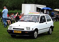 Base model three-door Suzuki Swift with sealed beam headlights (Europe)