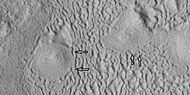 Brain terrain being formed, as seen by HiRISE under HiWish program Note: this is an enlargement of the previous image using HiView. Arrows indicate spots where brain terrain is beginning to form.