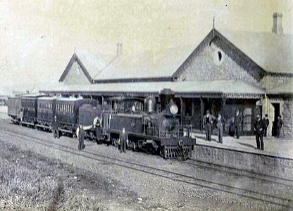 With tender, balloon chimney and "front porch railings", Grahamstown Station, c. 1880