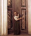 Bambina affacciata alla finta porta