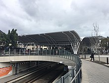 Large metal shelter over below ground railway station