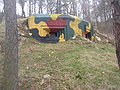 Back to 1938 state restored Pillbox Type 36 in a hillside above hamlet of Mlýnek near Žižice. It was a part of so-called Prague Line a section of pre-WWII Czechoslovak fortifications against Nazi Germany defending western approaches to Prague.