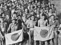 Image 72Australian soldiers display Japanese flags they captured at Kaiapit, New Guinea in 1943 (from History of the Australian Army)