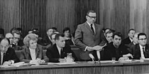 Minister of Education Margot Honecker listens as Assistant Secretary for Culture and Sport Roland Weissig addresses the 11th Council of State meeting in 1968.