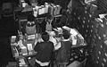 Workers packing candles into boxes